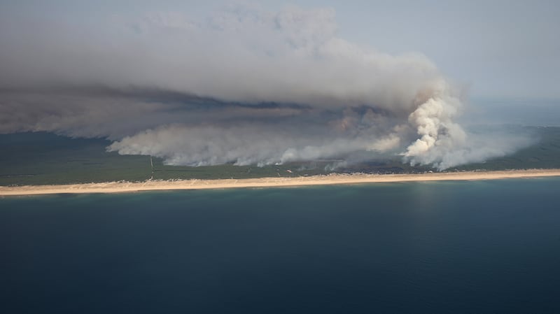 Smoke rises from the wildfire north of the Arcachon basin near Lege-Cap-Ferret, southwestern France. Photograph: Romain Perrocheau/AFP via Getty Images