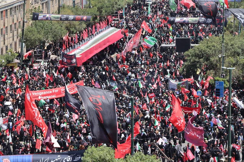 Mourners gather in the street ahead of the funeral of Iran's slain supreme leader Ali Khamenei and members of his family at the Shrine of Imam Reza, Iran's most revered place of worship, in Mashhad on Thursday.  Photograph: Atta Kenare/AFP via Getty Images