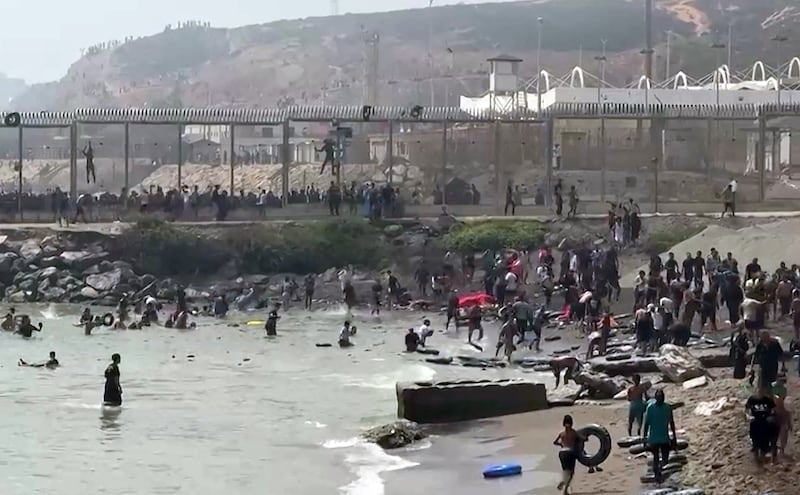 Migrants reaching the shore of Ceuta. Photograph: Lucía Diaz/AFP via Getty Images