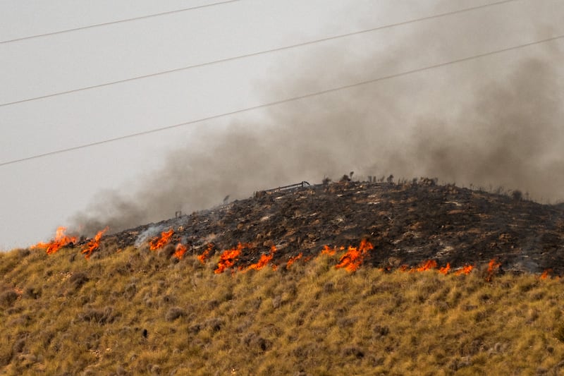 Flames stretching along a hillside on Saturday. Photograph: Jorge Guerreo/AFP via Getty Images