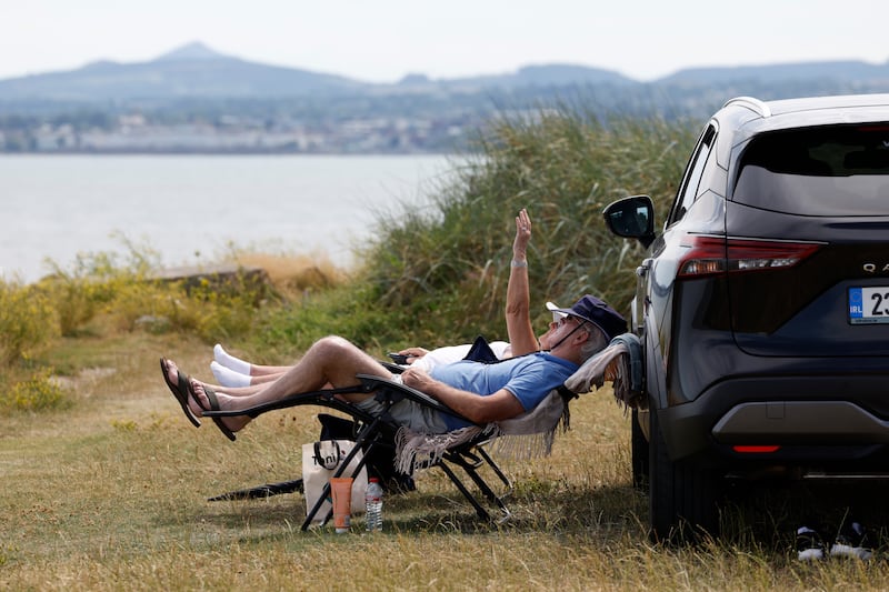 People cooling off by the sea in Dublin earlier this week. Photograph: Nick Bradshaw/The Irish Times
