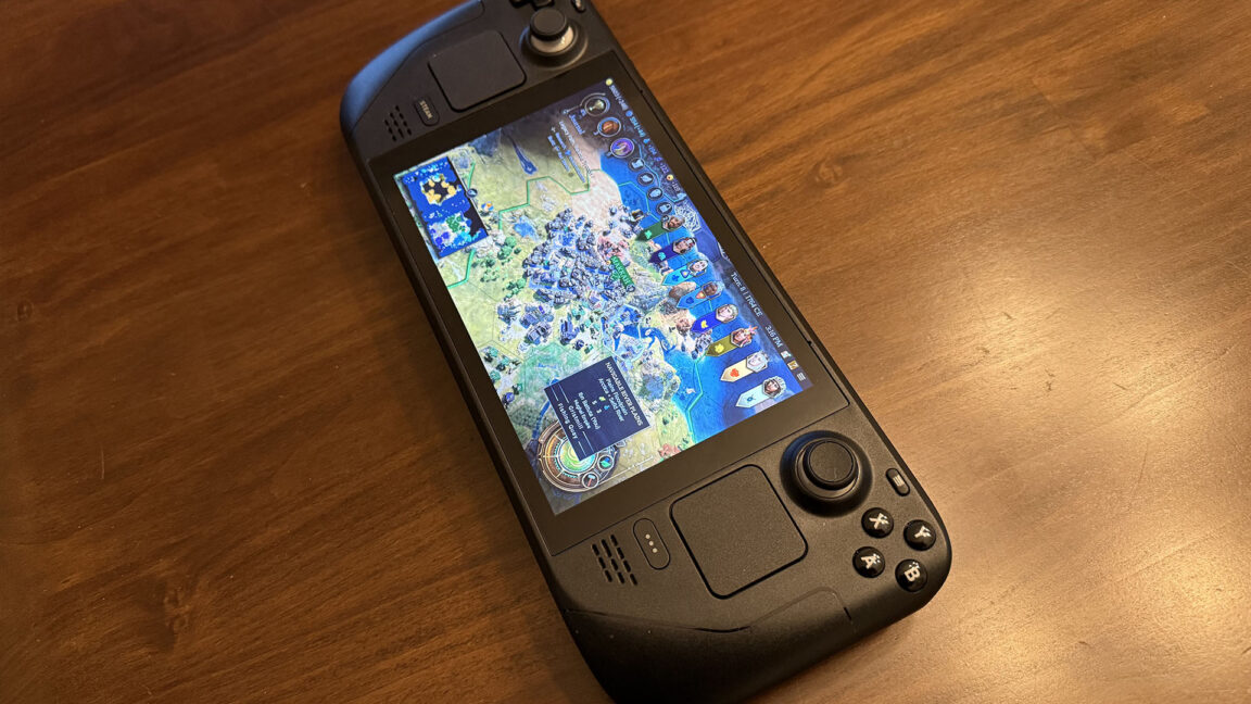 A Steam Deck sitting on a table with Civilization on the screen