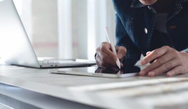 Close up of business woman using stylus pen signing e-document on digital tablet