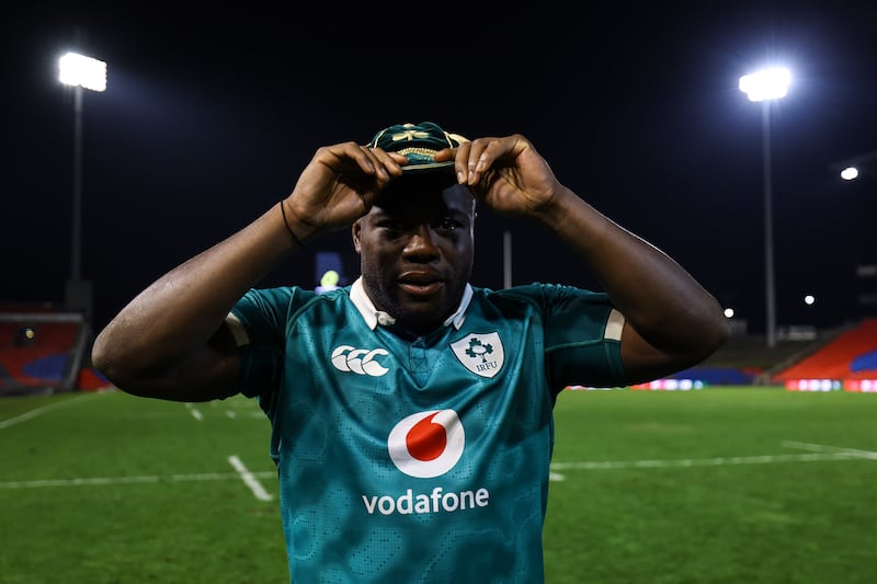 Sam Illo with his first cap after making his debut for Ireland. Photograph: Ben Brady/Inpho