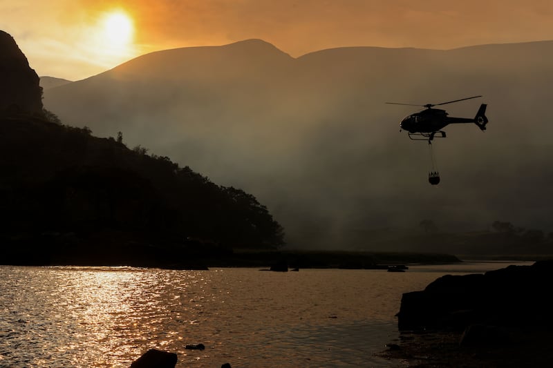Two helicopters using buckets were deployed in Killarney National Park to assist ground crews in tackling the blaze. Photograph: Valerie O'Sullivan/NPWS