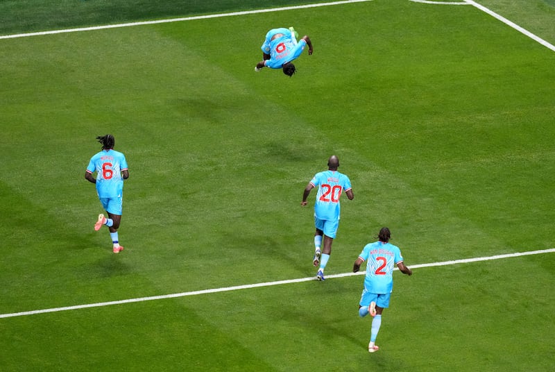 DR Congo Brian Cipenga (top) celebrates after scoring his side's first goal during the World Cup Round of 32 match at the Mercedes-Benz Stadium in Atlanta. Photograph: Nick Potts/PA Wire