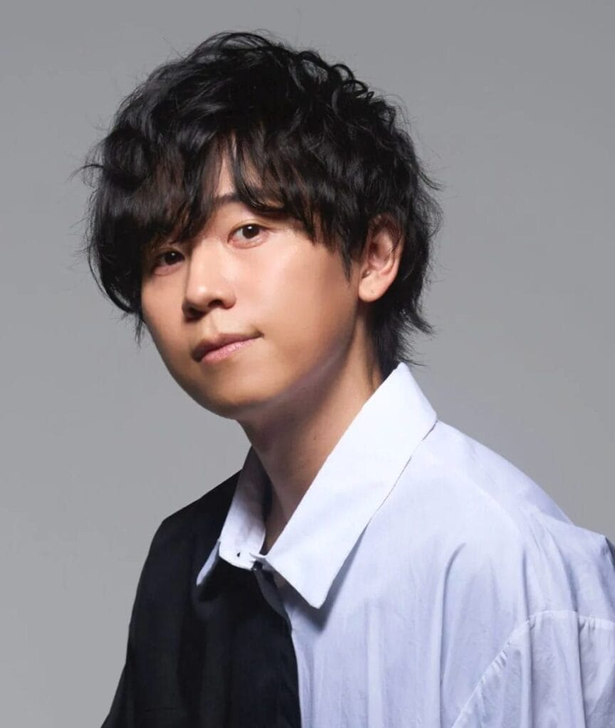 Headshot for Daiki Yamashita, who is wearing a black-and-white dress shirt in front of a grey background