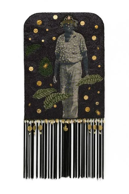 A mixed-media artwork depicts a grayscale figure adorned with gold dots, surrounded by gold spots, leaves, and decorative elements on a black background with dangling tassels at the bottom.