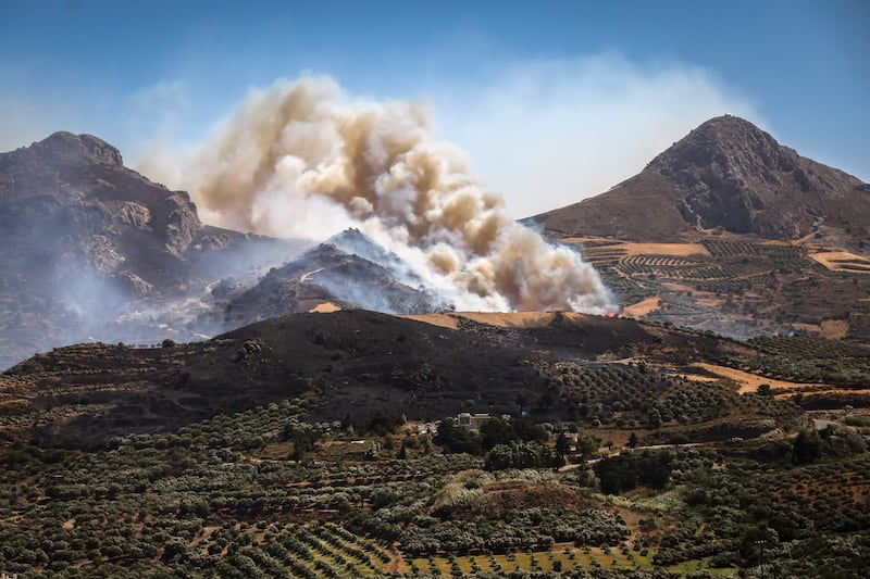 A fire burns near the village of Asomatos on the Greek island of Crete on Thursday. Photograph: Costas Metaxakis / AFP via Getty Images