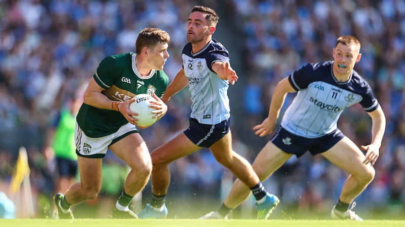 Kerry's Gavin White tries to evade Dublin's Niall Scully in Croke Park on Sunday. Photograph: James Crombie/Inpho