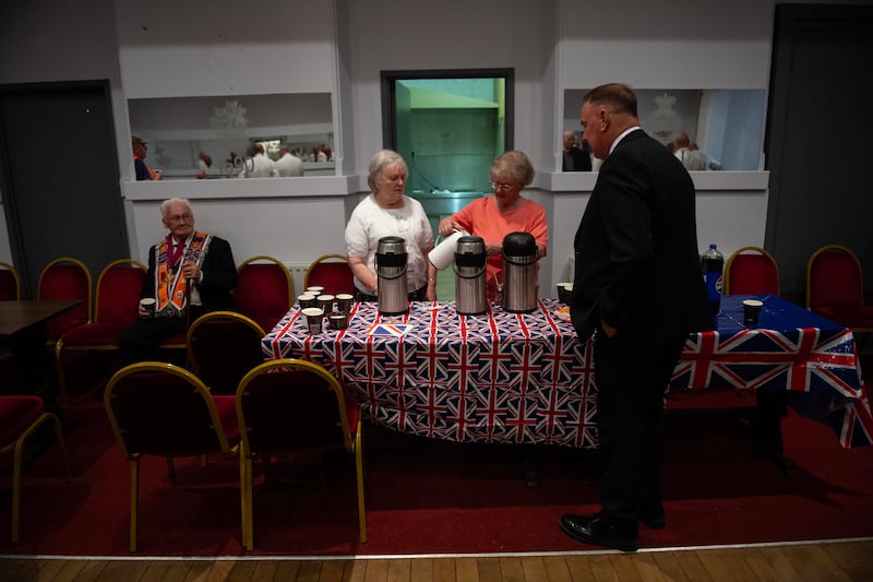 Members of the Orange Order have a tea break at Clifton Street Orange Hall. Photo: EPA/Shutterstock