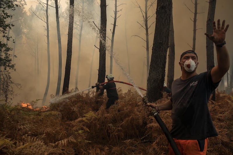 Firefighters and volunteers battle a forest fire in Lanton during wildfires in the Gironde region of southwestern France on Wednesday. Photograph: Ed Jones/AFP via Getty Images