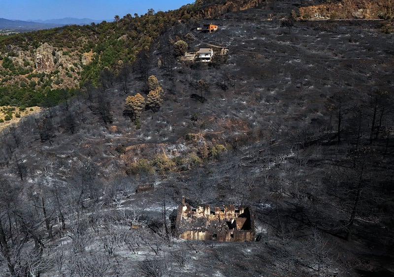 A burnt-out house in the Iruelas Valley surrounded by scorched ground following a devastating wildfire, near El Tiemblo, 80km west of Madrid, on Thursday. Photograph: Oscar Del Pozo/AFP via Getty Images