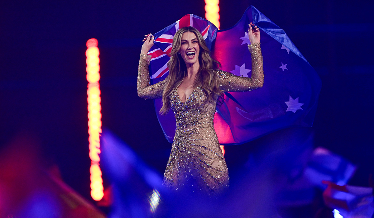 VIENNA, AUSTRIA - MAY 16: Delta Goodrem representing Australia walks into the grand final carrying an Australian flag during the Grand Final of the 70th Eurovision Song Contest at Wiener Stadthalle on May 16, 2026 in Vienna, Austria. (Photo by Christian Bruna/Getty Images)