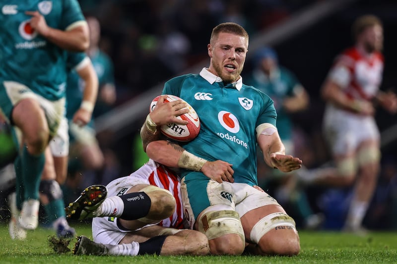 Ireland's Sean Jansen is tackled by Japan's Tiennan Costley. Photograph: Ben Brady/Inpho