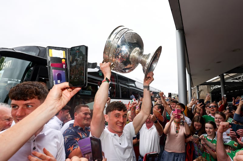 Jack Coyne arrives with the Sam Maguire Cup at Heuston Station in Dublin. Photo: INPHO/Grace Halton