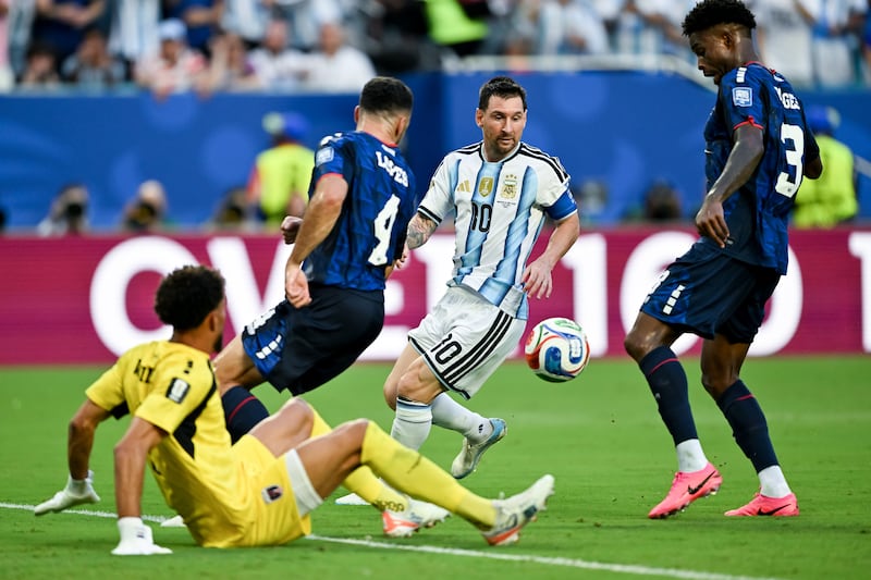 Cape Verde's Pico Lopes and Diney Borges in action against Argentina's Lionel Messi. Photograph: Enzo Santos Barreiro/Inpho