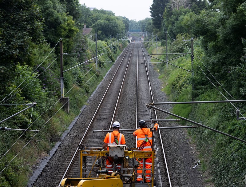 Maintenance crews repair an overhead cable at Raheny Dart station in June. Photograph: Sam Boal/Collins 

