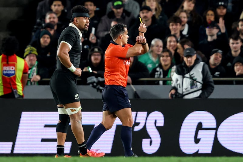 Referee Nic Berry shows a yellow card after Luke Jacobson's foul, but he could have shown a straight red. Photograph: Ben Brady/INPHO