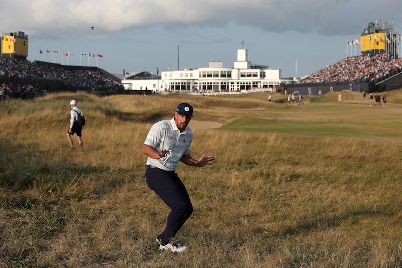 Bryson DeChambeau of the United States reacts to a rules official on the 18th hole on day three of The Open. Photograph: Andrew Redington/Getty