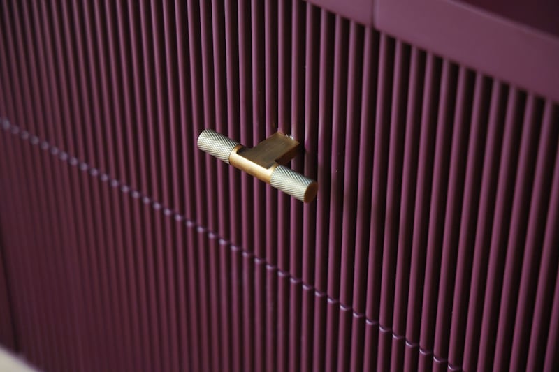 Purple drawers with brass handles. Photograph: Bryan O'Brien