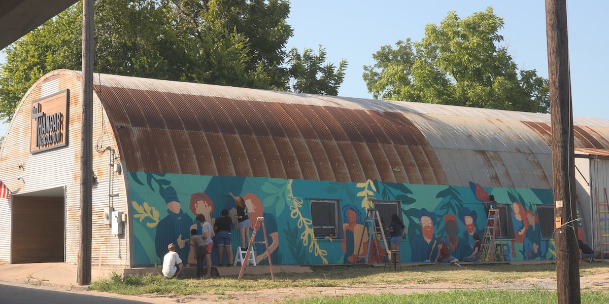 Rapoport Academy students paint mural on The Hangar in Downtown Waco