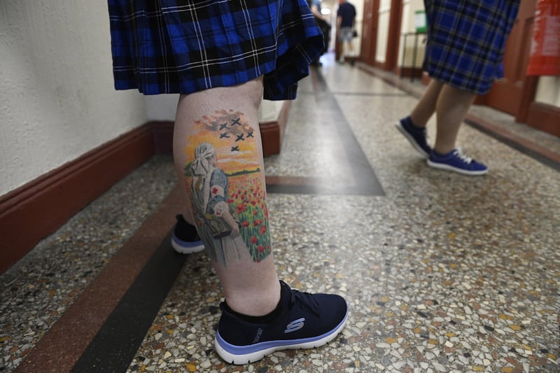 A tattoo on the leg of a band member of the Orange Order at Clifton Street Orange Hall. Photo: EPA/Shutterstock