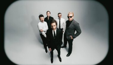 Interpol stare down AI on atmospheric new single 'Iron City'