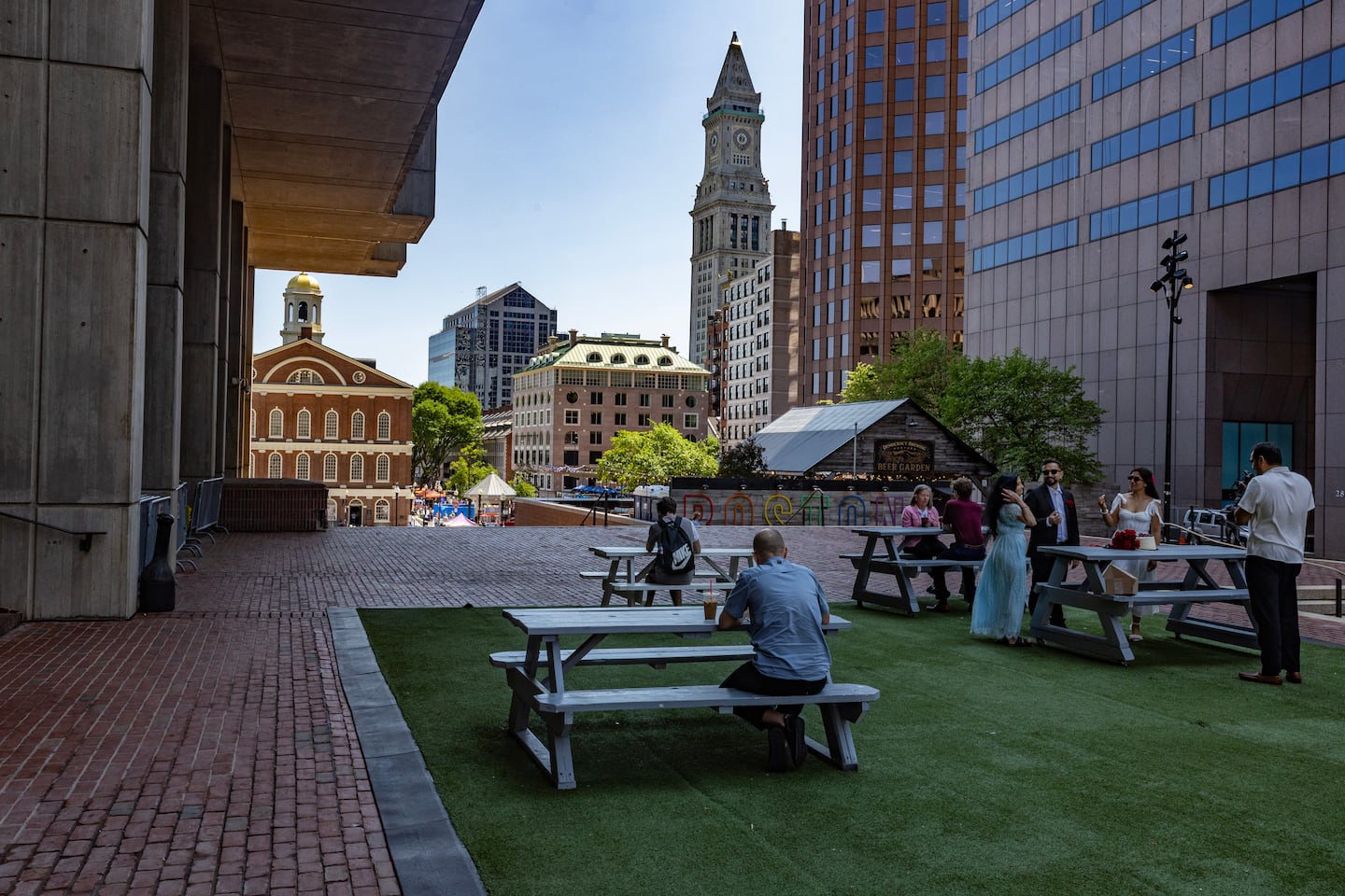 The buildings offer a fine frame for Faneuil Hall and the Custom House from City Hall Plaza.