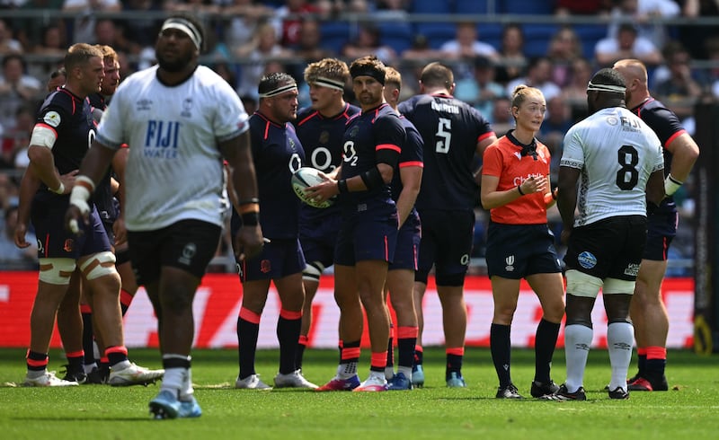 Referee Hollie Davidson speaks with Fiji's number eight, Levani Botia, during the game against England on Saturday. Photograph: Oli Scarff/Getty