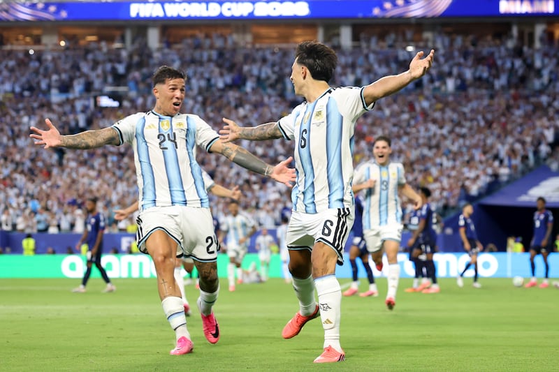 Lisandro Martínez celebrates scoring Argentina's second goal with team-mate Enzo Fernandez. Photograph: Steph Chambers/FIFA via Getty Images