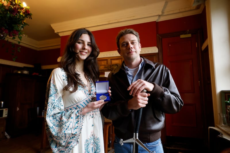 Perin Winders, treasurer of the University Philosophical Society in 2025, presenting the honorary patronage to Jonathan Anderson. Photograph: Nick Bradshaw