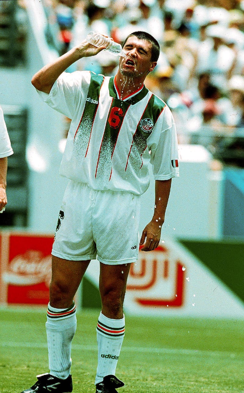 Ireland’s Roy Keane pours water on himself during the game. Photograph: Billy Stickland/Inpho