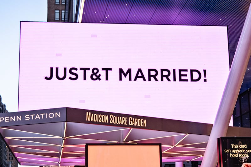 A pink billboard at Madison Square Garden reads 'JUST&T MARRIED' during Taylor Swift and Travis Kelce's wedding celebration in New York on July 3rd. Photograph: Laura Brett/EPA