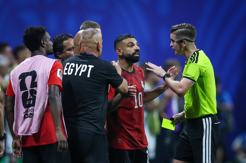 Head coach Hossam Hassan and Mohamed Salah of Egypt talk with referee Francois Letexier during the Fifa World Cup 2026 Round of 16 match between Argentina and Egypt at Atlanta Stadium in Atlanta, United States, on July 7, 2026. Photograph: Ayman Aref/NurPhoto via Getty Images