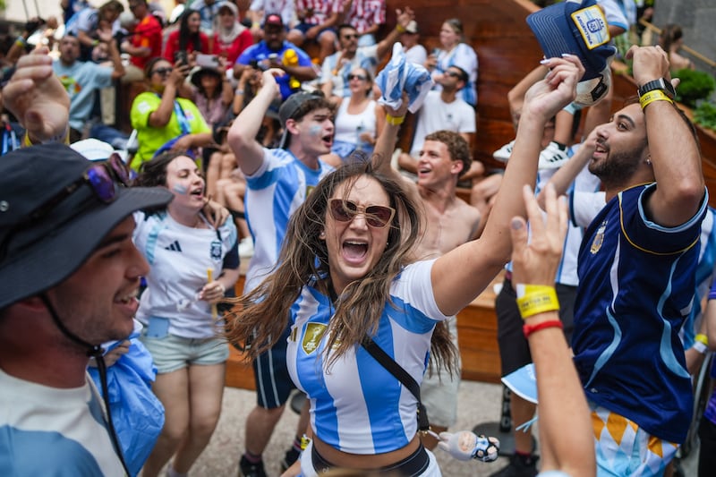 Argentina fans cheer during a watch party at Rockefeller Center ahead of the 2026 World Cup Final between Spain and Argentina in New York on July 19, 2026. (Photo by Ryan MURPHY / AFP via Getty Images)
