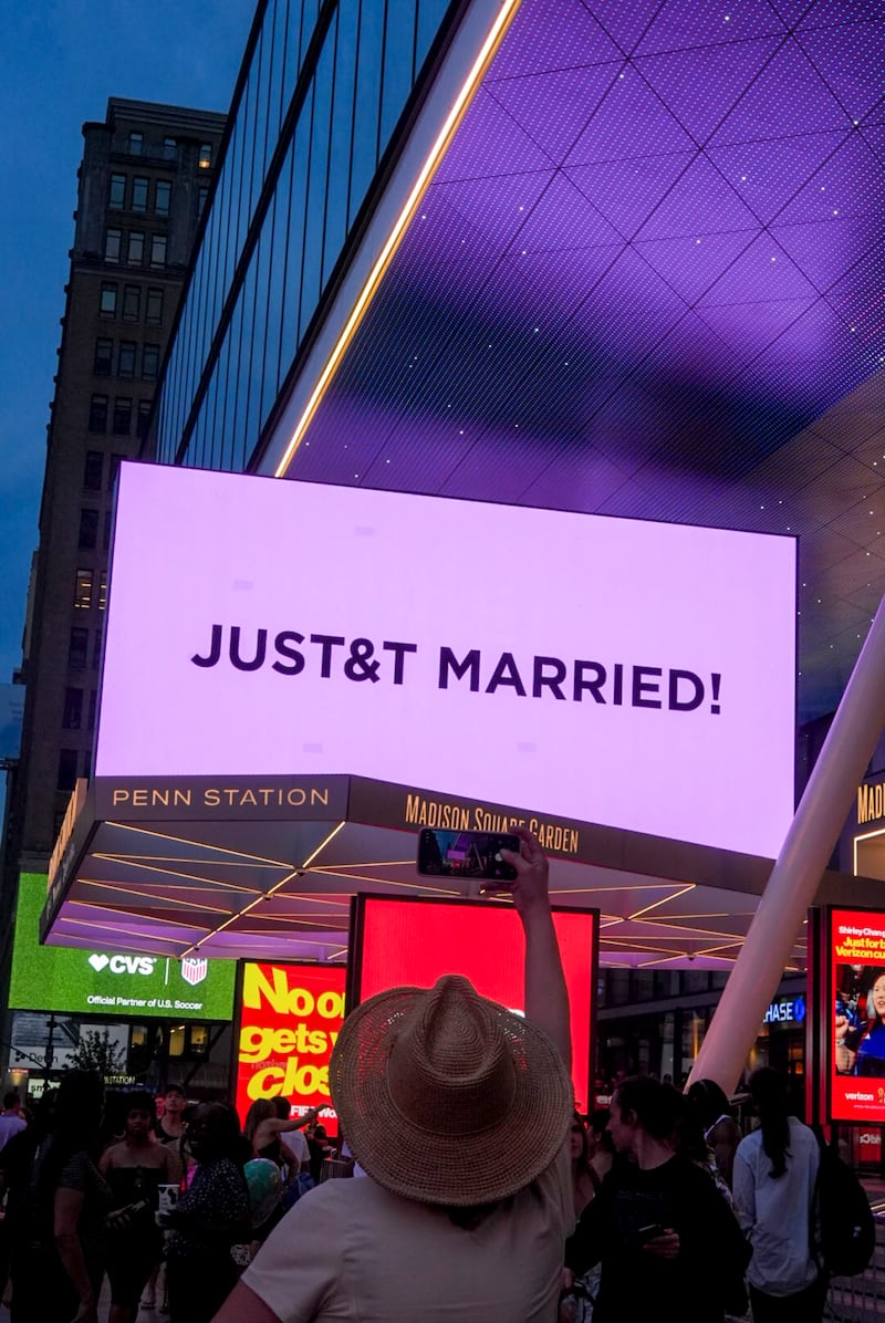 A sign announcing the marriage of Taylor Swift and Travis Kelce outside Madison Square Garden in New York. Photograph: Jutharat Pinyodoonyachet/The New York Times