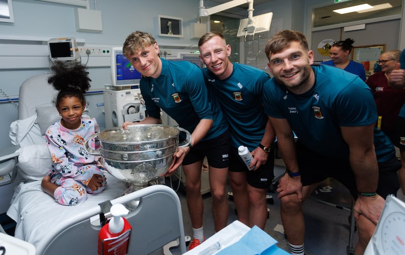 Mayo footballers visit Amy Lily Cusack and other young patients at Temple Street Children's Hospital in Dublin. Photo: INPHO/Tom Maher