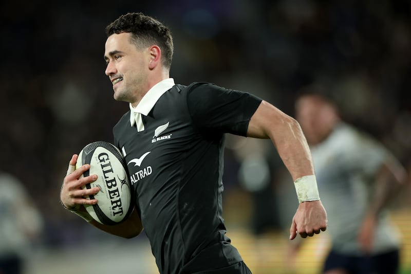 Will Jordan of the New Zealand All Blacks smiles as he runs in for a try during the Nations Championship against Italy. Photograph: Phil Walter/Getty