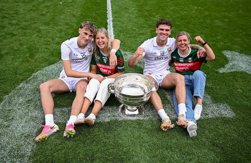 Mayo players Kobe McDonald, left, and Jordan Flynn with their partners Leah Meheady, second from left, and Jessie Brown. Photo: Seb Daly/Sportsfile via Getty Images