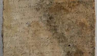 Ancient Greek inscription carved on a weathered stone tablet for historical study.