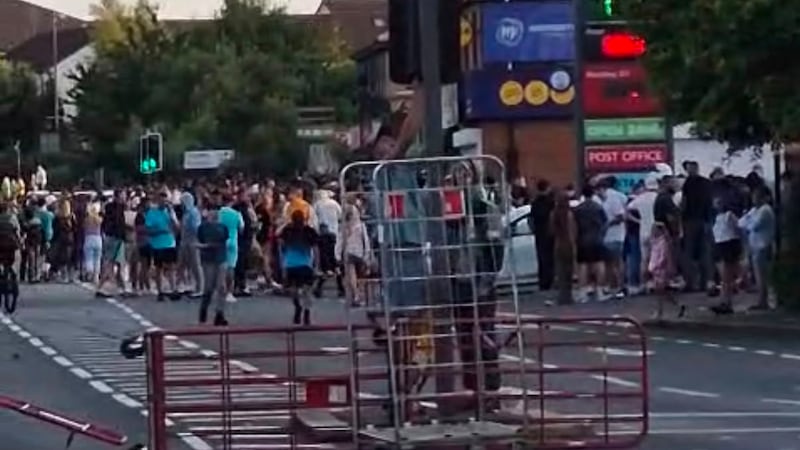 ‘Absolute chaos’ in west Belfast as police close off road due to ‘large crowds’ in area