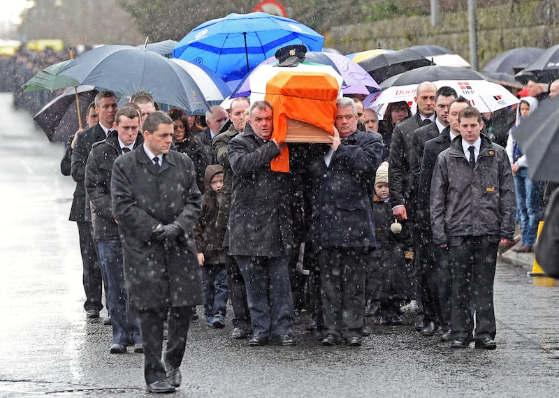 Det Garda Adrian Donohoe's remains are carried into the church for his funeral in Dundalk, Co Louth, in 2013. Photograph: Eric Luke 