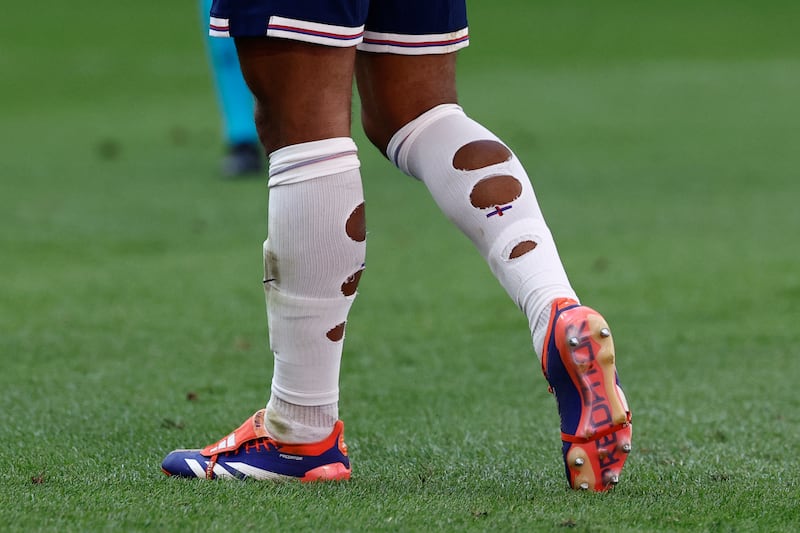 Would you look at the state of young Jude Bellingham's socks. Photograph: Kenzo Tribouillard/AFP via Getty Images          