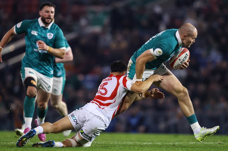 Japan's Takuro Matsunaga tackles Ireland’s Jacob Stockdale. Photograph: Ben Brady/Inpho