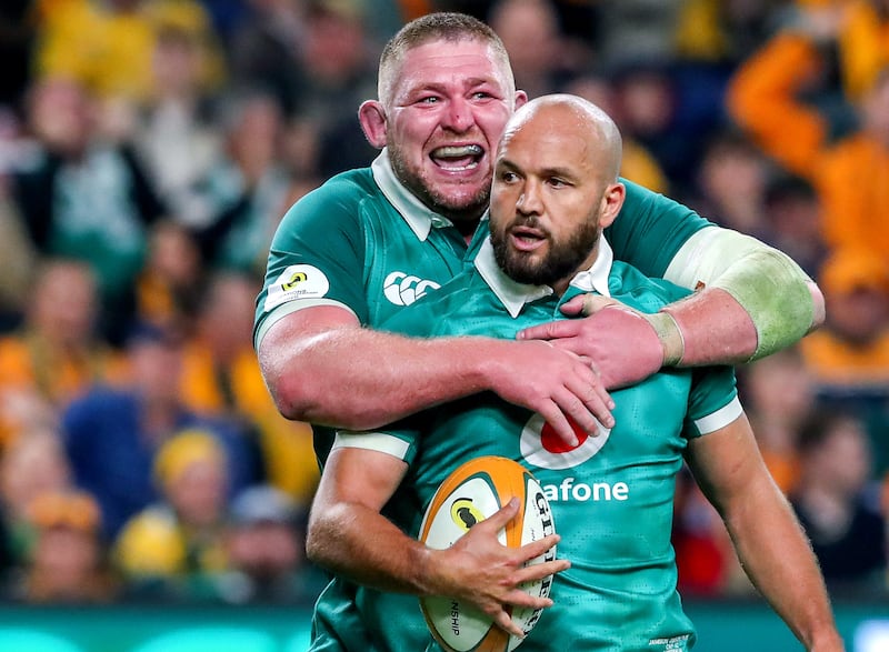 Jamison Gibson-Park celebrates scoring a try for Ireland with team-mate Tadhg Furlong. Photograph: David Neilson/Inpho