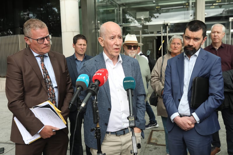 Osgur Breatnach outside the Criminal Courts of Justice in Dublin on Tuesday, flanked by his solicitor Kevin Winters (left) and Joe O'Brien from Irish Council for Civil Liberties (right). Photograph: Collins Courts