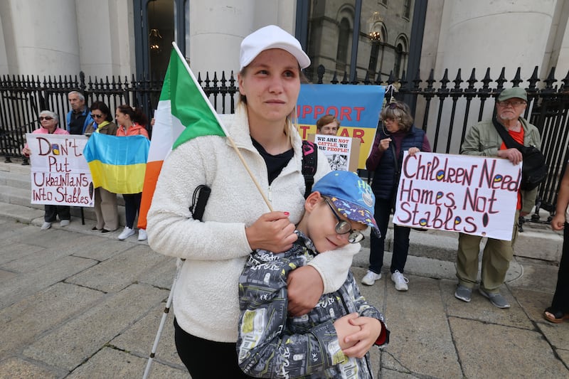 Tannya Trofimova, who is blind, with her son Anton (10). She said his sight is deteriorating
and he needs to be near medical services. Photograph: Alan Betson

