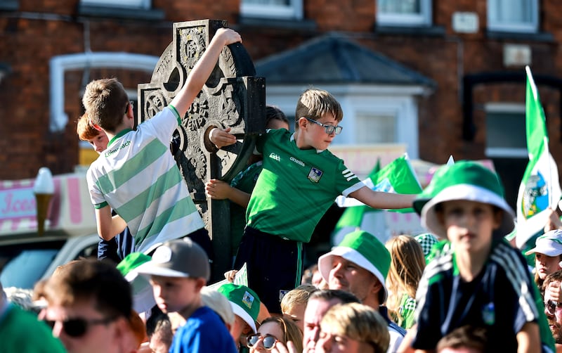 Vantage points were at a premium as thousands turned out to welcome the Limerick hurlers on Monday. Photograph: James Crombie/Inpho