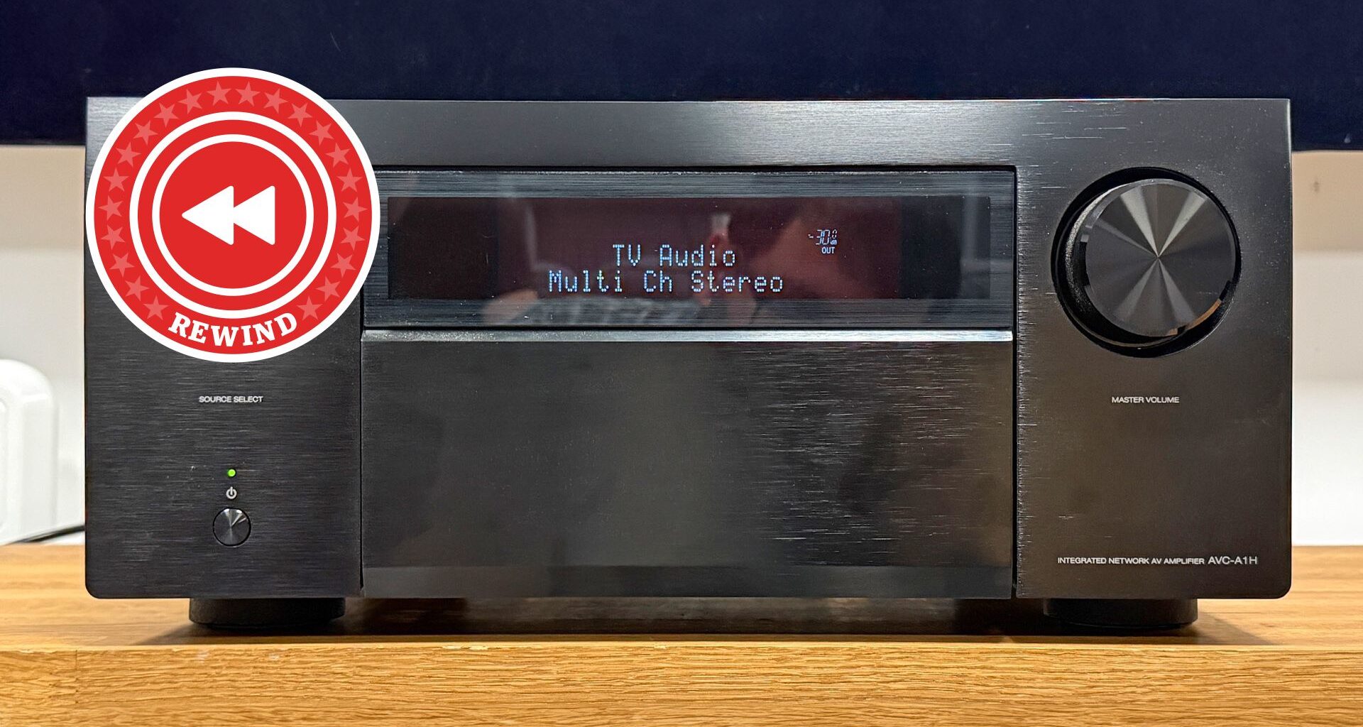 Denon AVR on table with Rewind logo